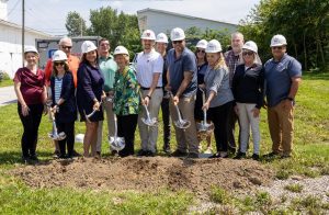 Team with shovels poised to break ground at the site of the new ITM